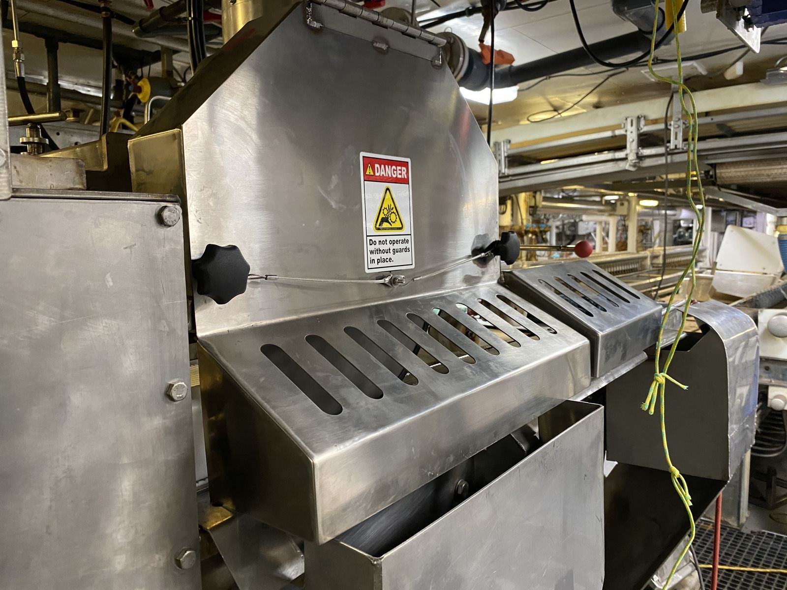 Stainless steel food processing equipment in a production facility