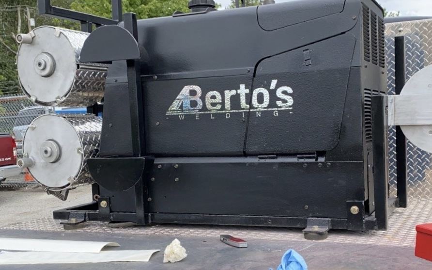 Berto's-branded welder and cable reels mounted on the flatbed of the mobile welding truck