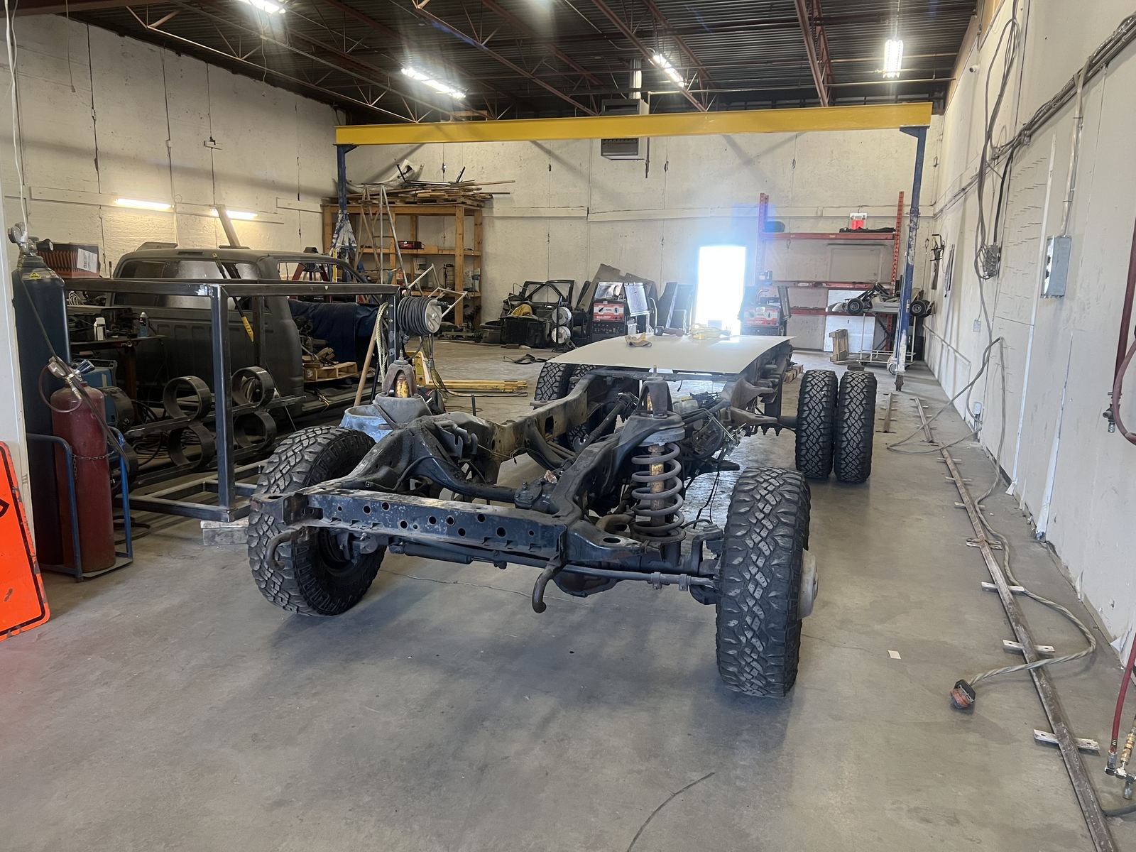 Off-road truck chassis on the shop floor, mid-build