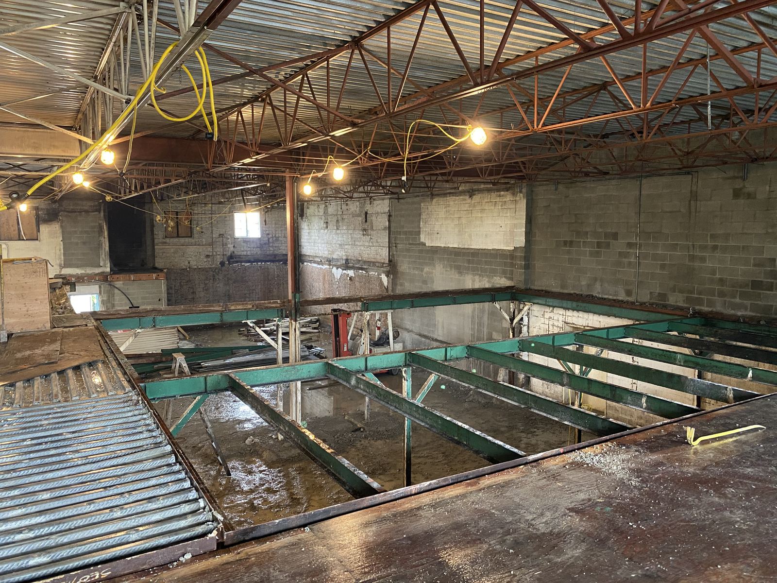 New steel floor framing inside an old brick warehouse